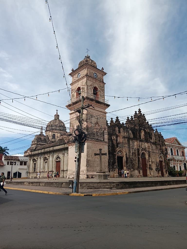 Historic stone cathedral and bell tower in a city square