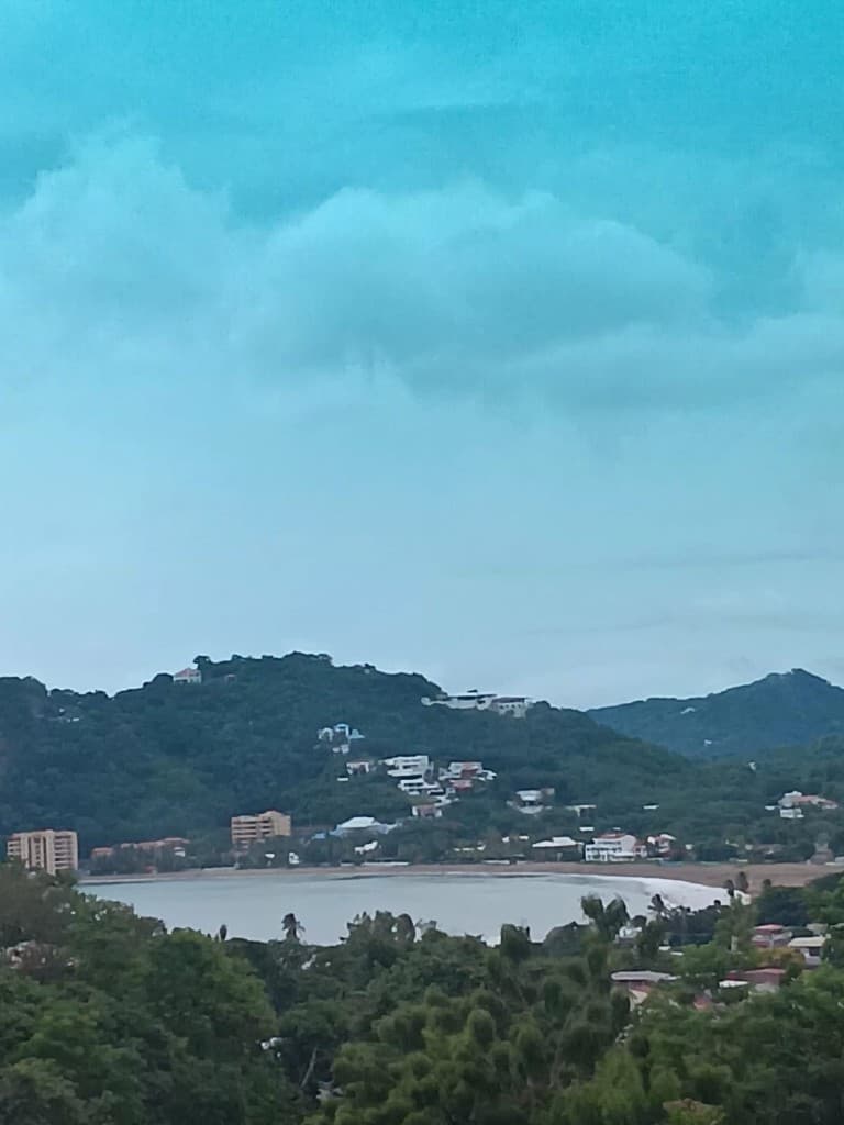 Coastal bay and hills above turquoise water